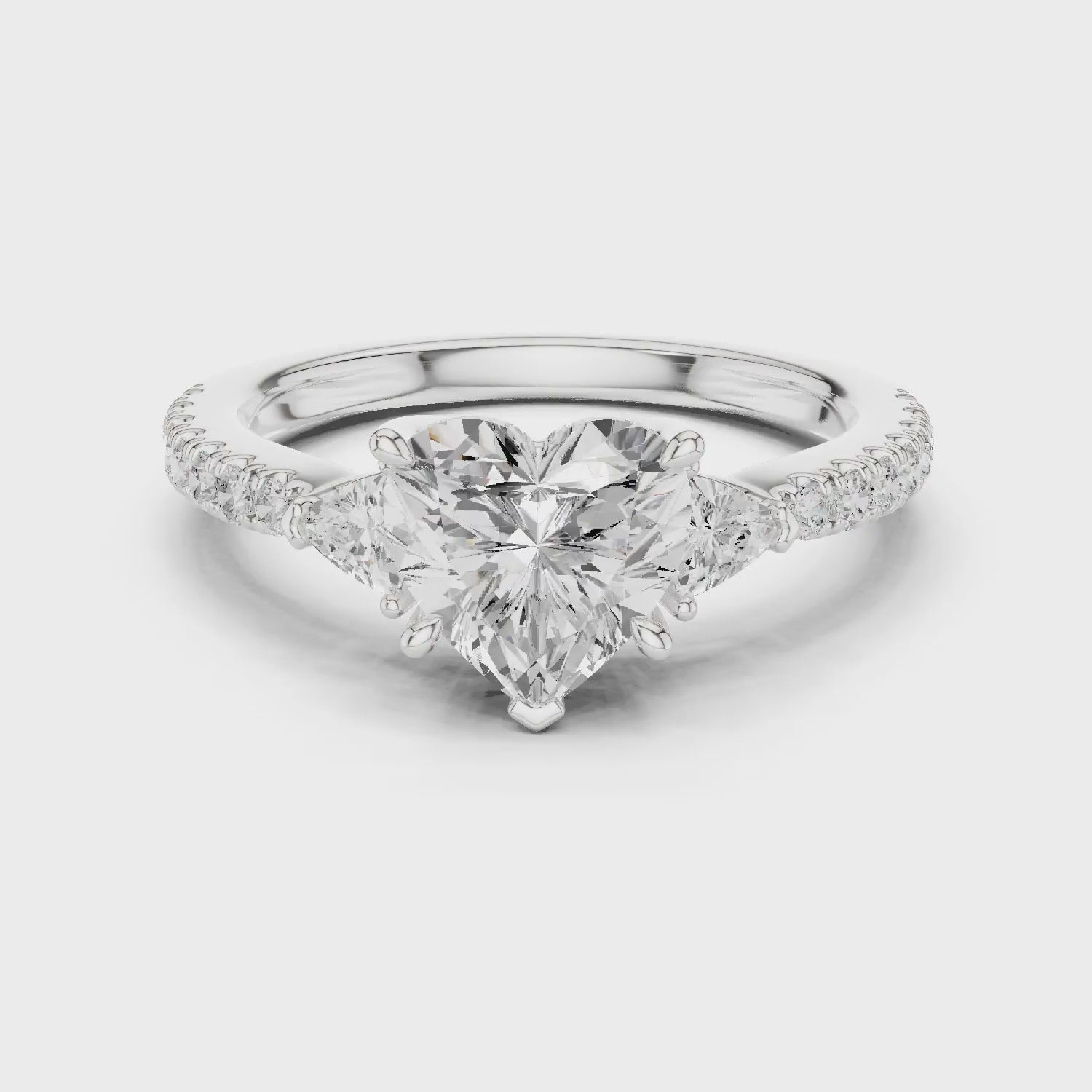 Heart Cut Diamond Three-Stone Engagement Ring with Pave Band