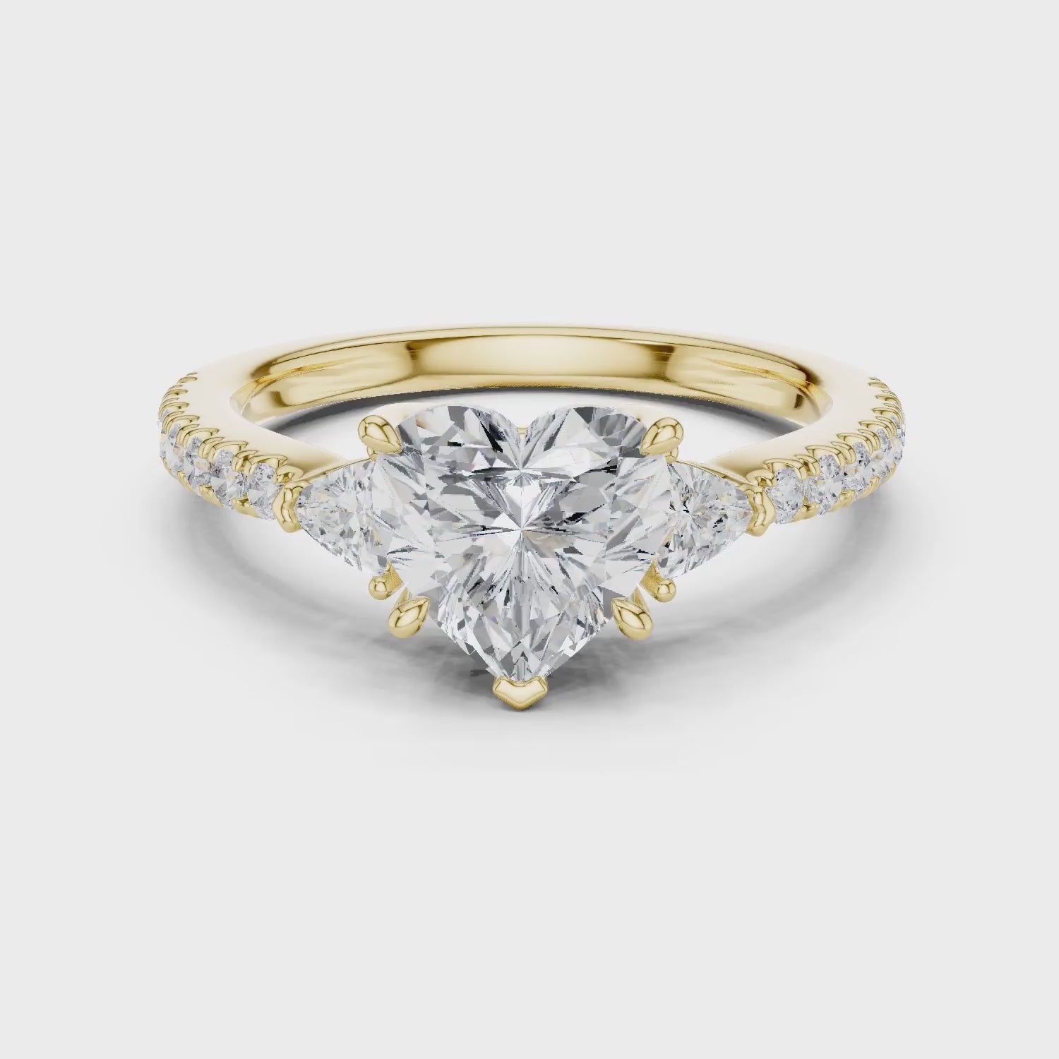 Heart Cut Diamond Three-Stone Engagement Ring with Pave Band